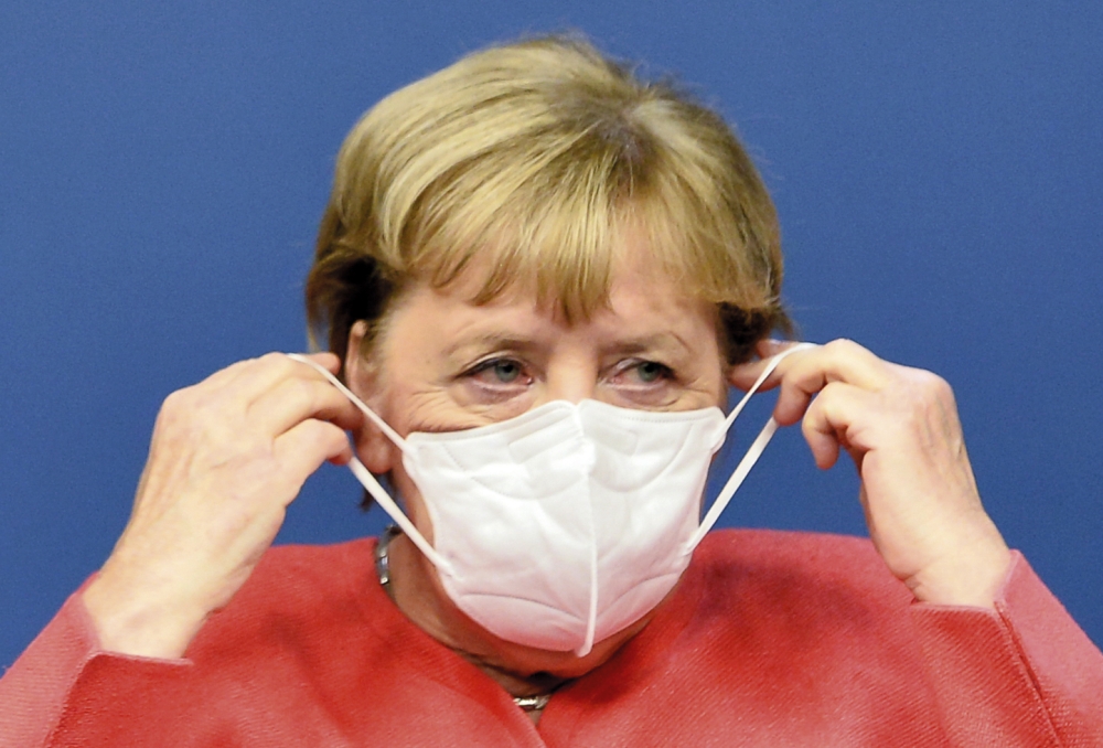 ميركل تلمح لإغلاق جزئي وتشديد إجراءات كورونا