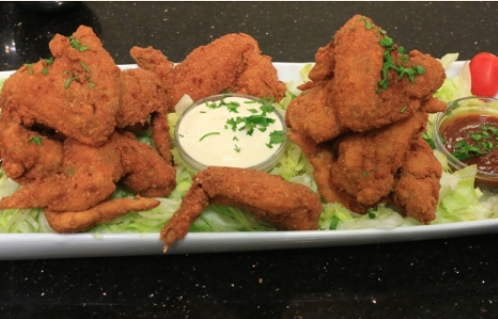 طريقة عمل أجنحة الدجاج بانيه