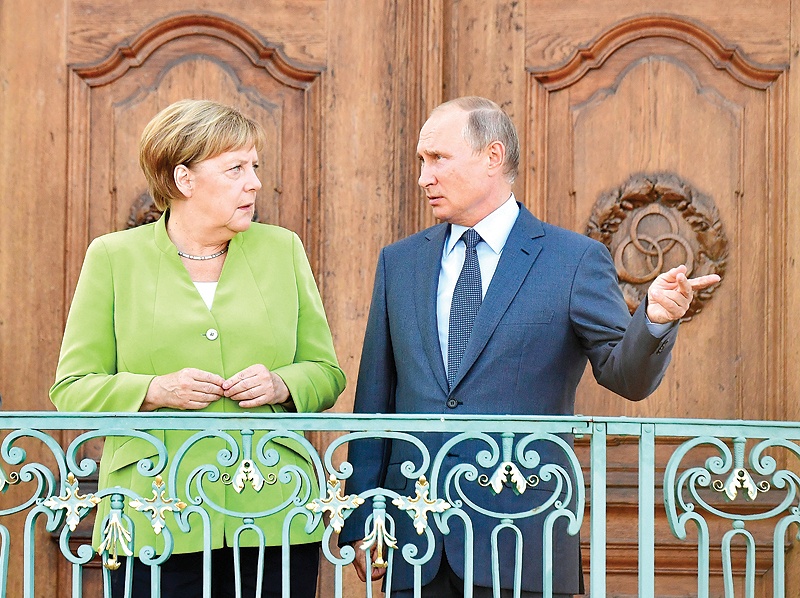 بوتين وميركل