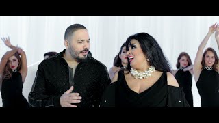 رامي عياش و فيفي عبده خلال كليب سكاكر السكر