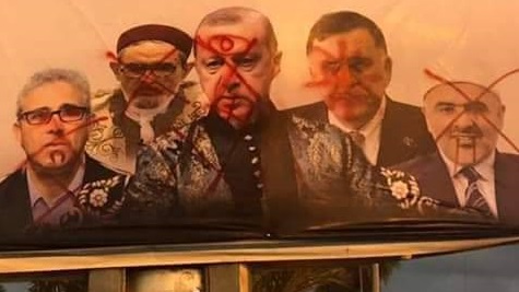 صورة للمتسببين في أزمة ليبيا بأحد شوارع طرابلس