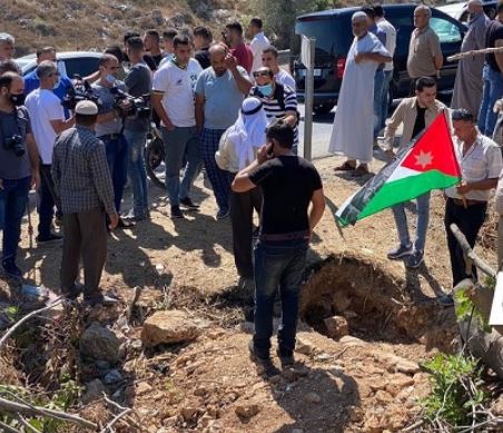 جانب من نقل رفات الجندي الأردني