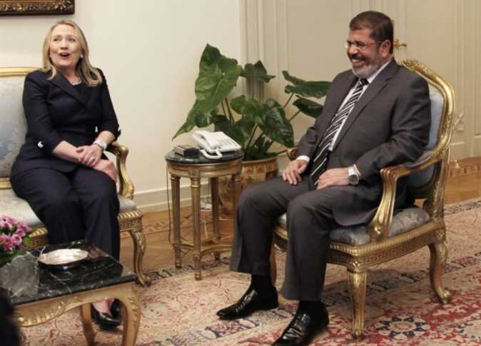 مرسي وكلينتون