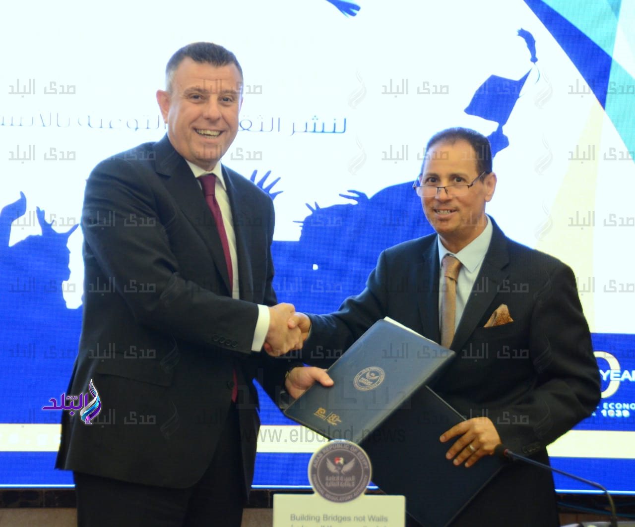 جانب من بروتوكول التعاون لرفع مستويات الوعي المالي