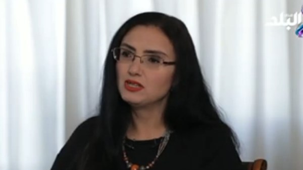 لكاتبة ريم بسيوني، الروائية وأستاذ اللغويات بالجامعة الأمريكية