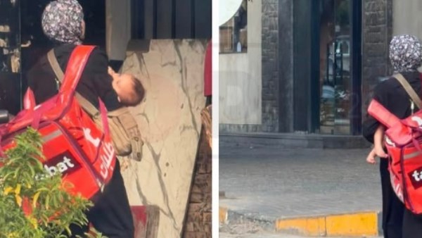 في مشهد إنساني.. مندوبة توصيل تحتضن صغيرها الرضيع خلال حملها صندوقًا على ظهرها